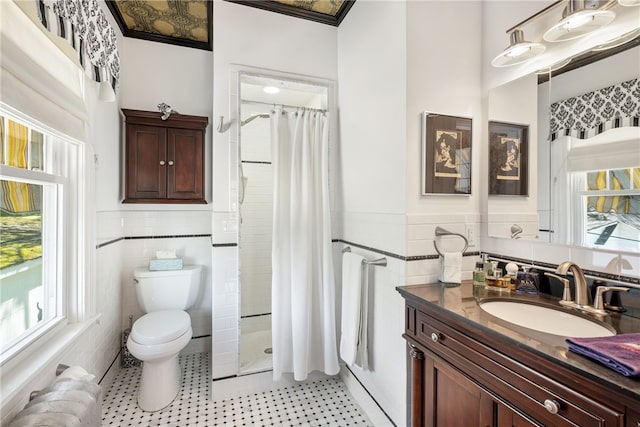 bathroom with toilet, radiator heating unit, wainscoting, and tile walls