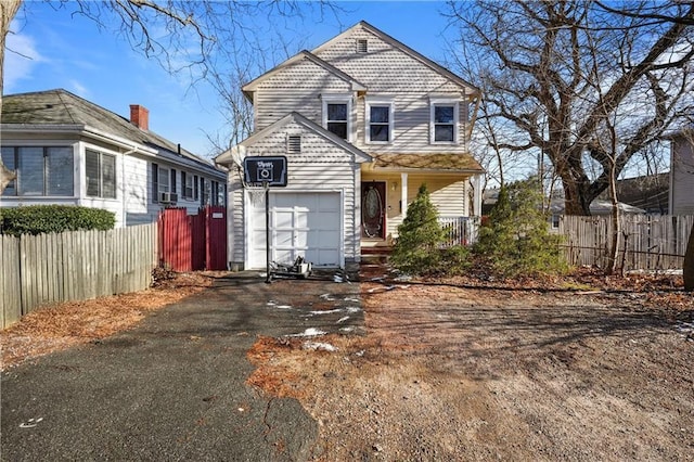 view of front facade featuring a garage and covered porch