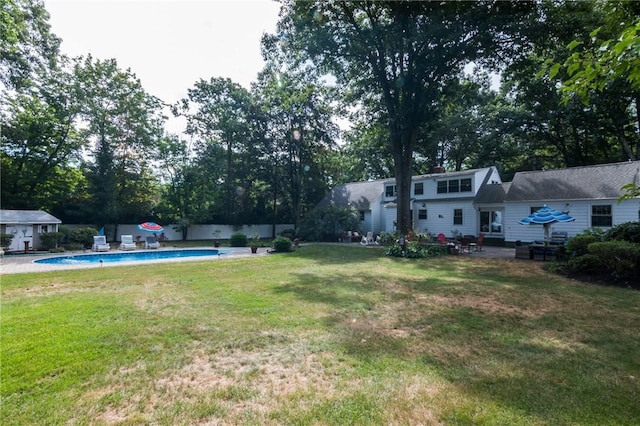 view of yard featuring a fenced in pool and a patio