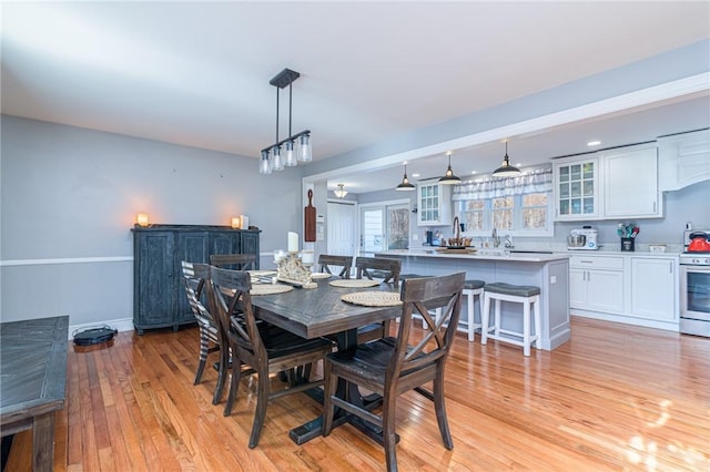 dining area featuring light wood-type flooring