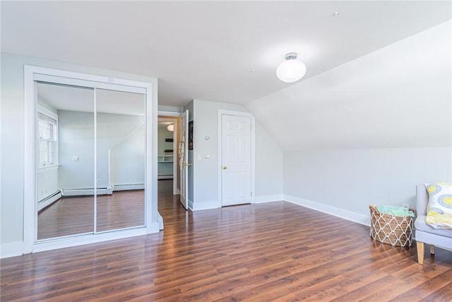 bonus room featuring lofted ceiling and dark hardwood / wood-style flooring