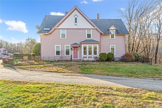 victorian home with a front yard