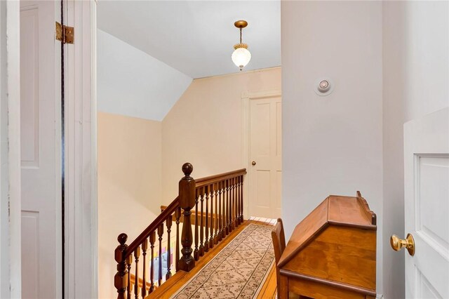 staircase with vaulted ceiling