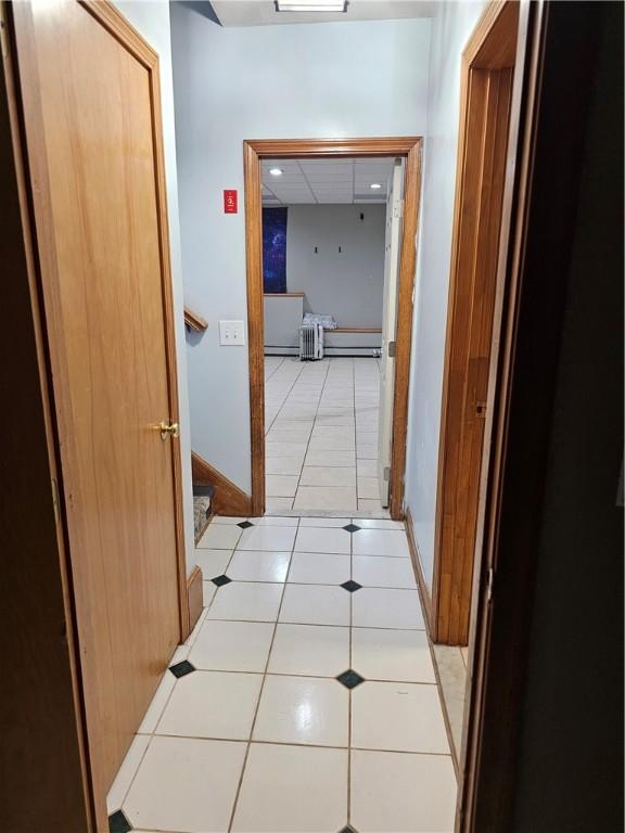 hallway with light tile patterned floors