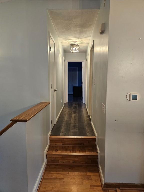 hall featuring dark wood-type flooring