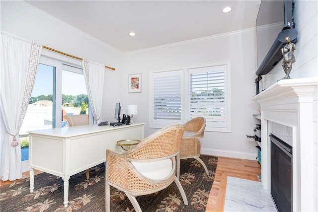 office featuring light wood-type flooring and crown molding