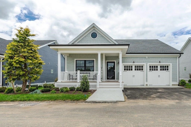 view of front facade featuring a garage and a porch