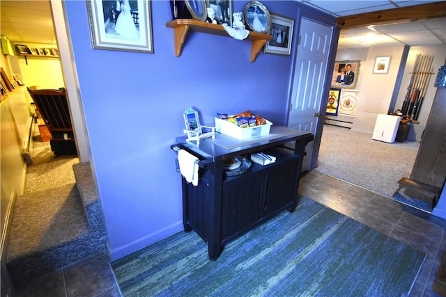 office area featuring dark colored carpet