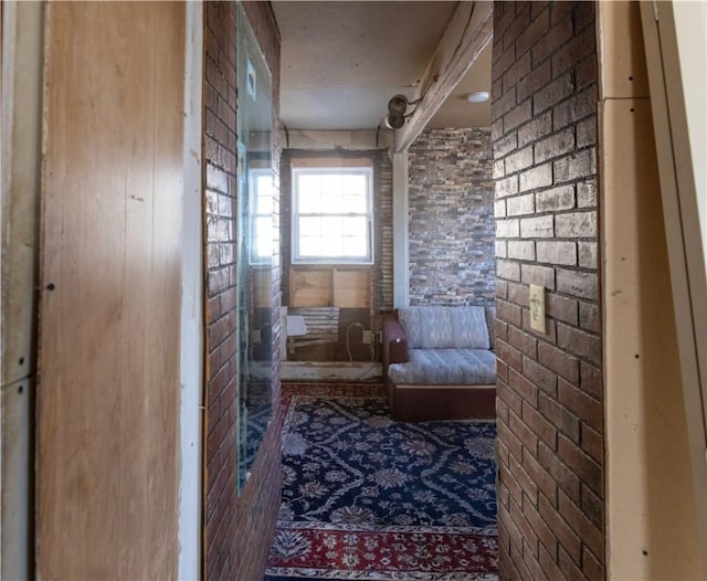 sitting room with brick wall