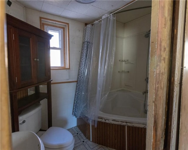 bathroom with toilet and shower / bath combo with shower curtain