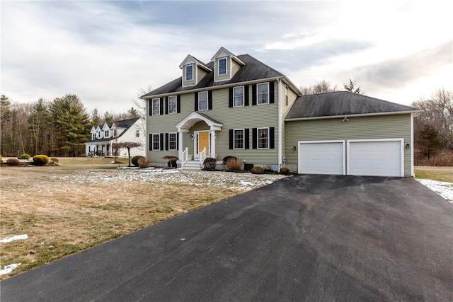 colonial home featuring a garage