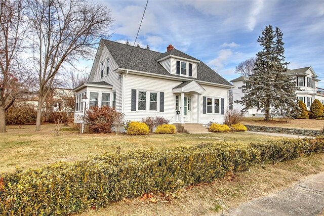 view of front facade with a front lawn