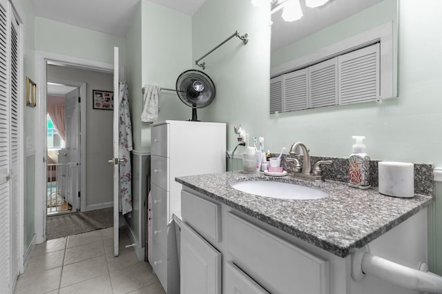 bathroom with vanity and tile patterned flooring