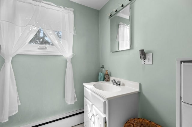 bathroom with vanity and a baseboard heating unit