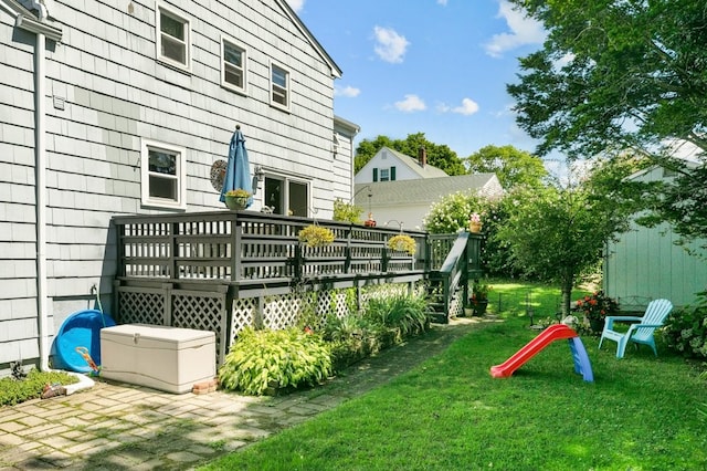 view of yard with a wooden deck
