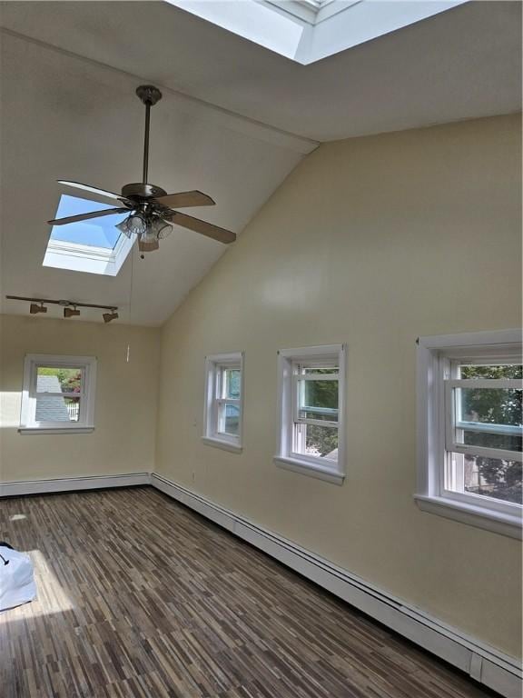 interior space featuring a skylight, high vaulted ceiling, ceiling fan, and a wealth of natural light