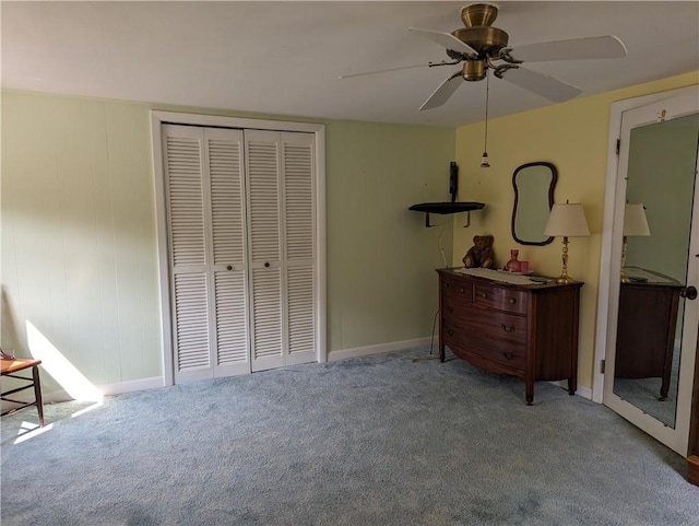 unfurnished bedroom featuring ceiling fan, carpet, and a closet