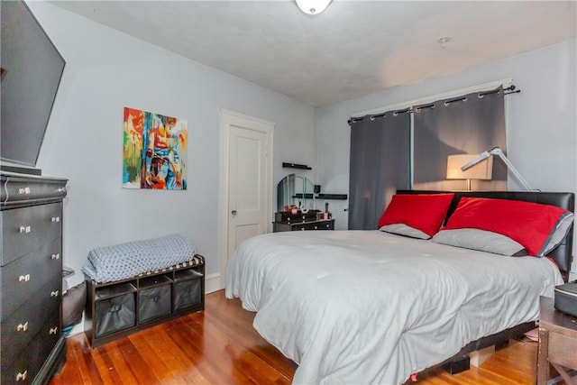 bedroom with wood-type flooring