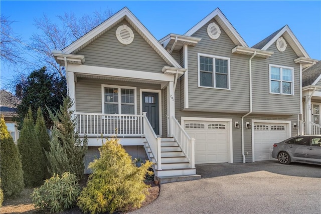 view of front of property with a garage and covered porch