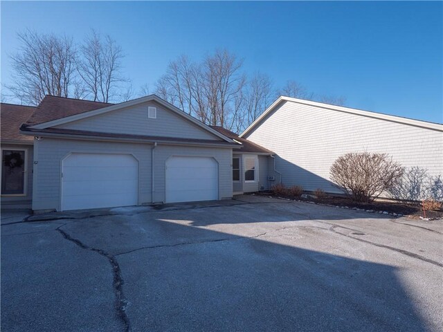 view of property exterior with a garage