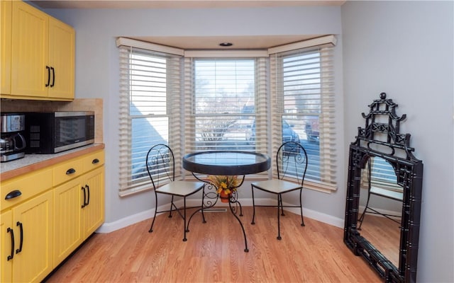 dining room with light hardwood / wood-style flooring