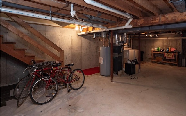 basement with independent washer and dryer and gas water heater