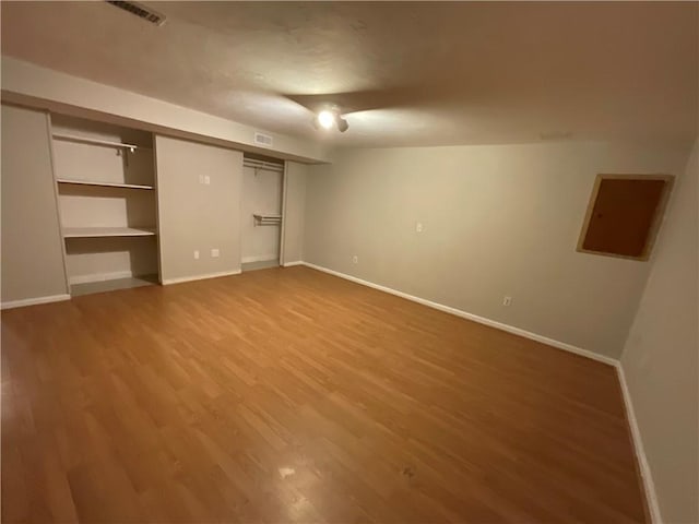 unfurnished bedroom featuring a closet and wood-type flooring