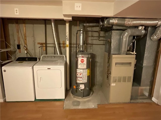 utilities featuring water heater and separate washer and dryer