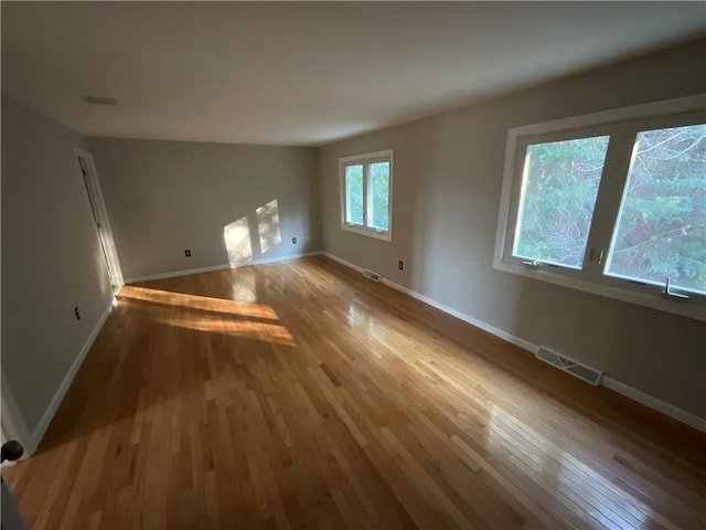 unfurnished living room featuring light hardwood / wood-style floors