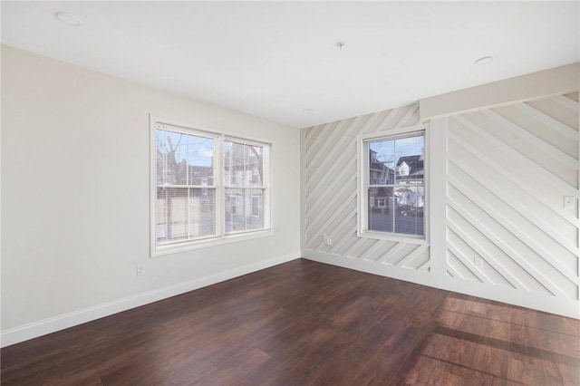 unfurnished room featuring dark hardwood / wood-style flooring