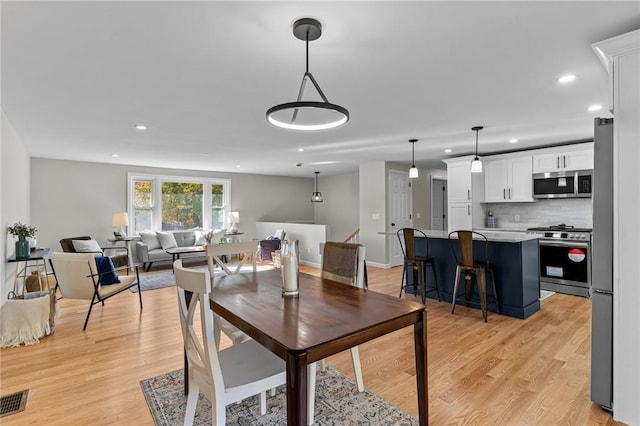 dining room with light hardwood / wood-style floors