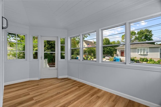 unfurnished sunroom with plenty of natural light