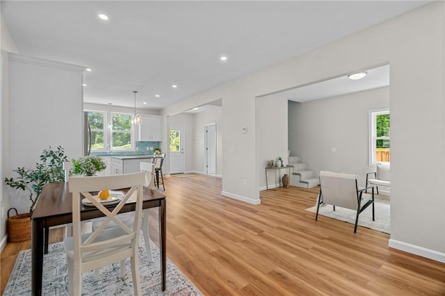 dining space featuring light hardwood / wood-style floors and a wealth of natural light