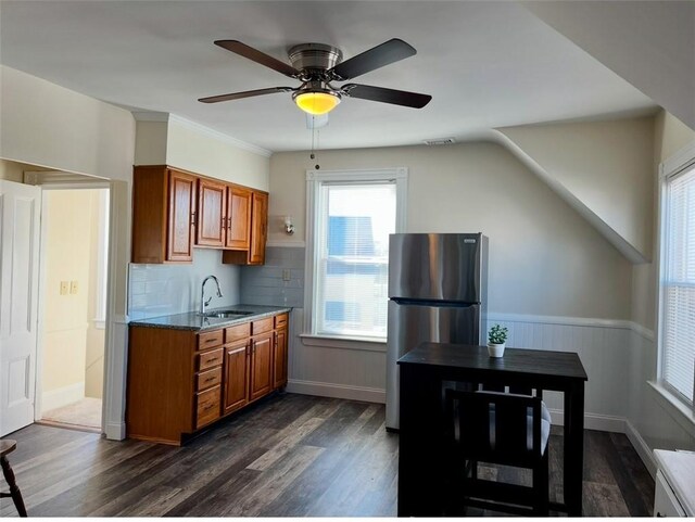 kitchen with sink, stainless steel fridge, dark hardwood / wood-style flooring, and plenty of natural light