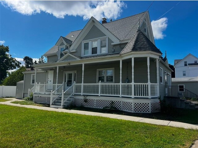 view of front of home featuring a front lawn and a porch