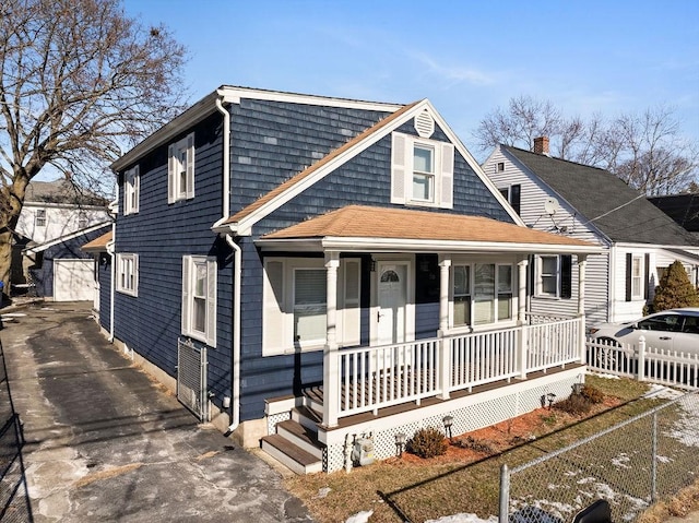 view of front of property with a porch and a garage