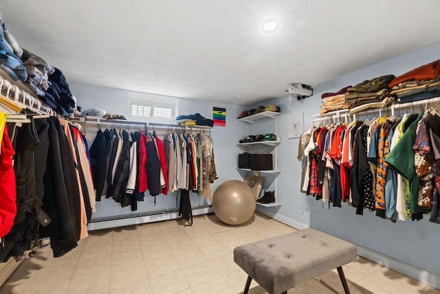 walk in closet featuring baseboard heating