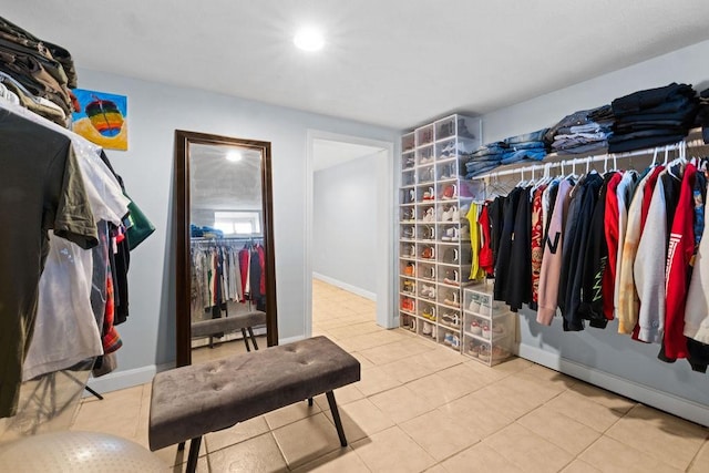 walk in closet with tile patterned flooring