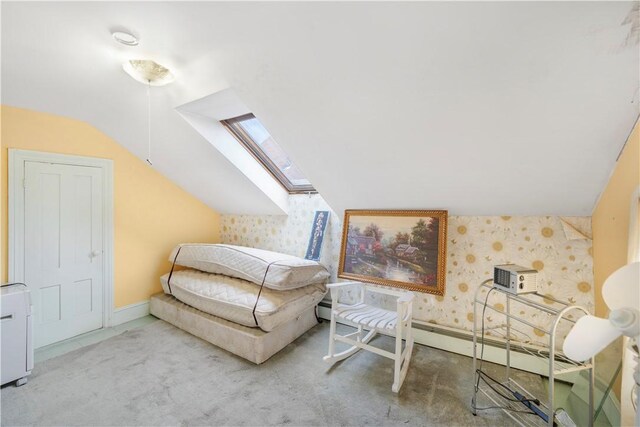 living area with lofted ceiling with skylight