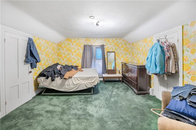 carpeted bedroom featuring lofted ceiling