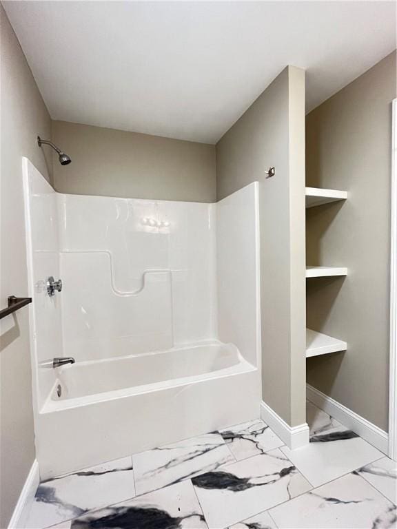 bathroom with shower / washtub combination