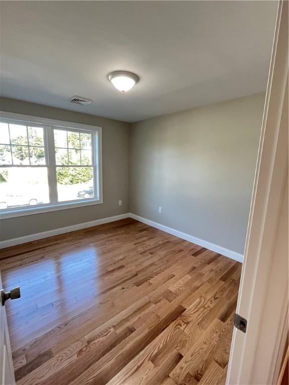 unfurnished room featuring light hardwood / wood-style flooring