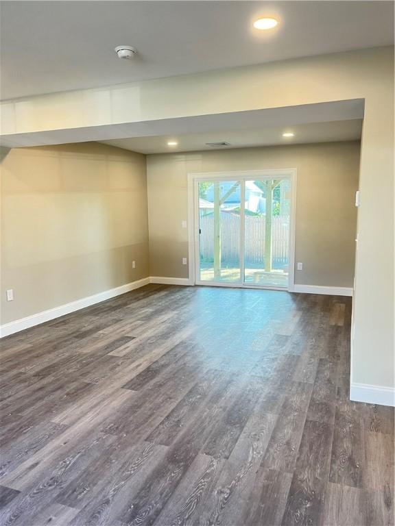 empty room featuring dark hardwood / wood-style floors