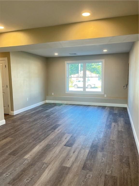 empty room featuring dark hardwood / wood-style floors