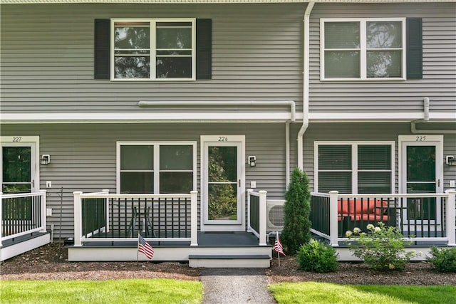 view of front of home featuring ac unit