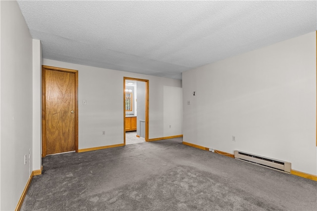 unfurnished room featuring dark colored carpet, a textured ceiling, and a baseboard radiator