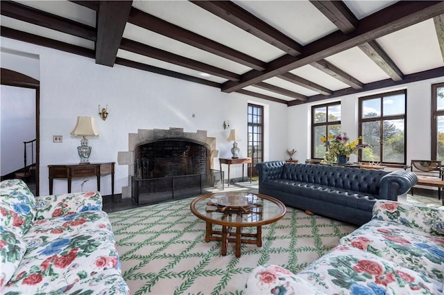 living room featuring beamed ceiling and coffered ceiling