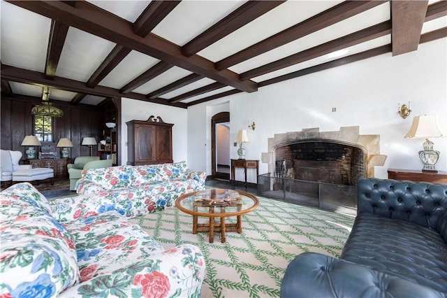 living room featuring beamed ceiling