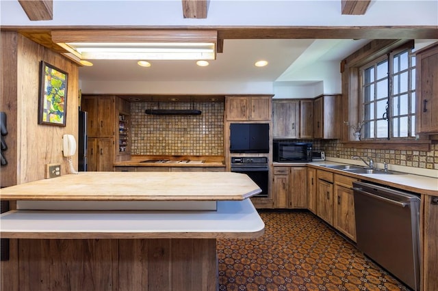 kitchen with sink, backsplash, and black appliances