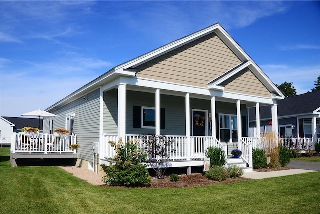 view of front of house featuring a front lawn and a porch